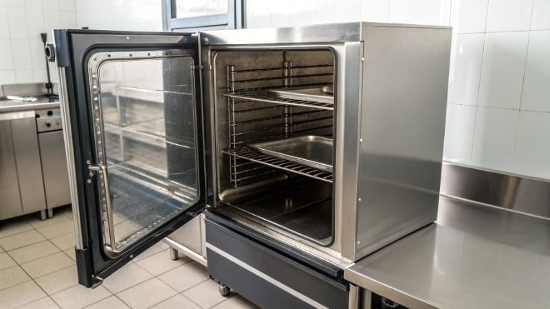 Empty Commercial Oven An empty commercial oven with its door open