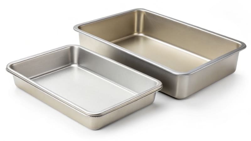 Commercial vs Home Baking Pans A commercial baking pan and a home baking pan side-by-side